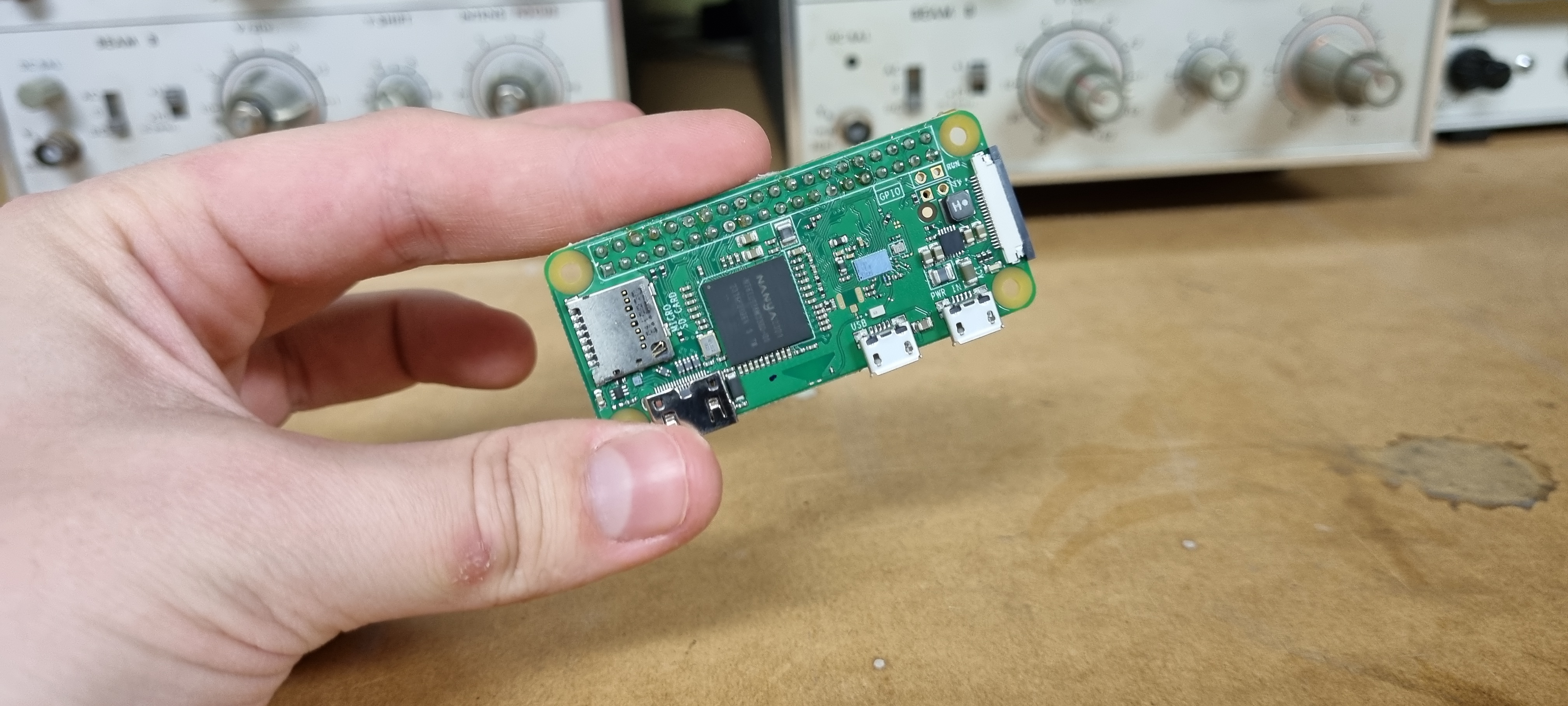 A raspberry pi zero held in-between my fingers