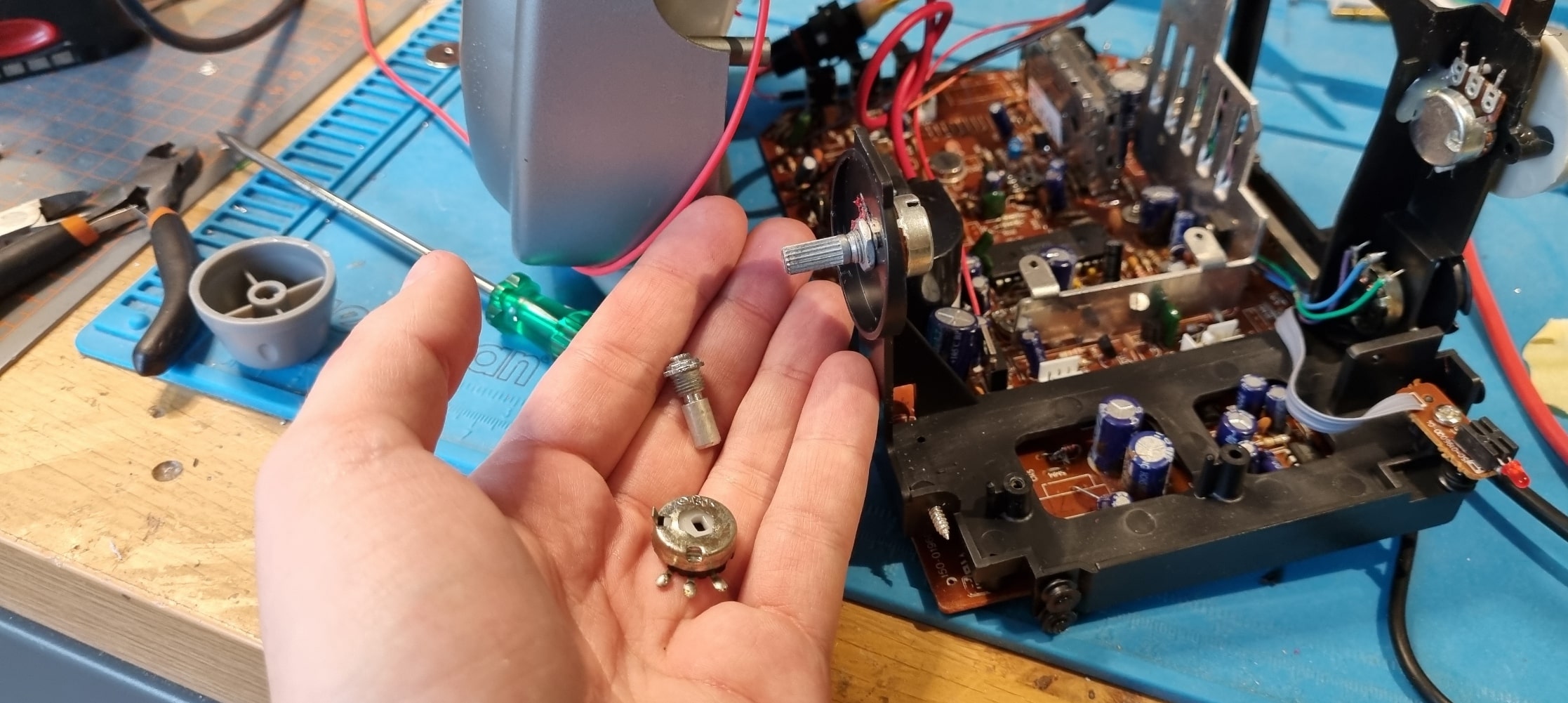 The old potentiometer (with the knob ripped off) next to the new ones, now fitted to the CRT.